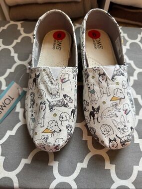 TOMS Women’s Slip-On Sneakers in White Dog Print